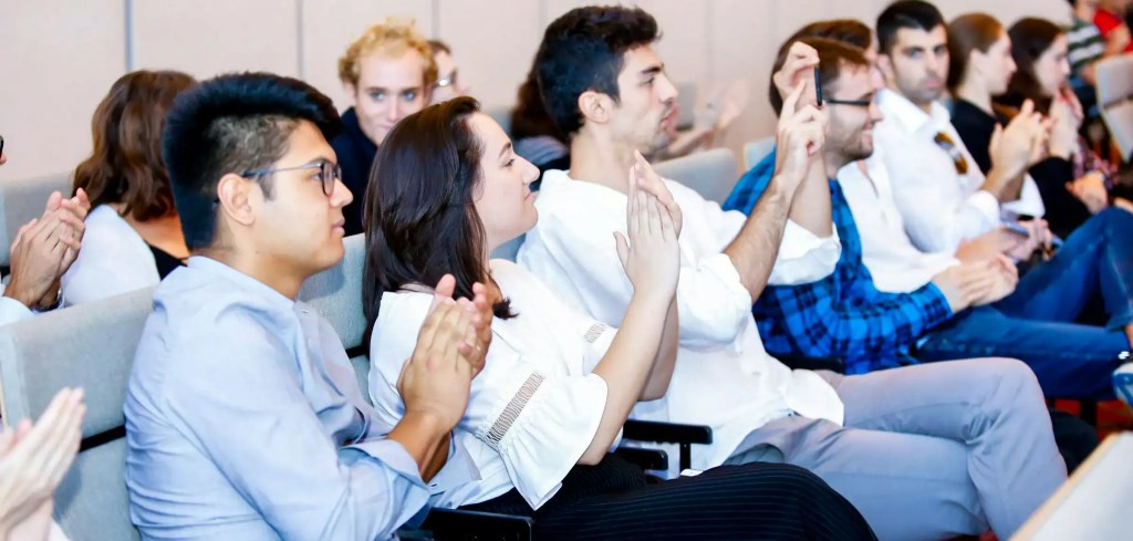 Master's Students listening to a lecture