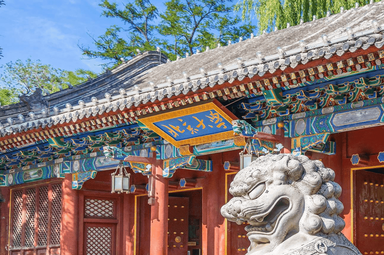 Peking University traditional gate with stone lion statue and ornate architecture in Beijing China