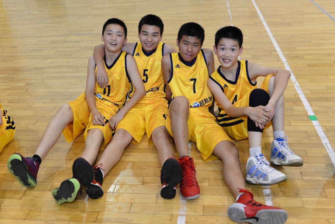 chinese students happy playing sports group photo