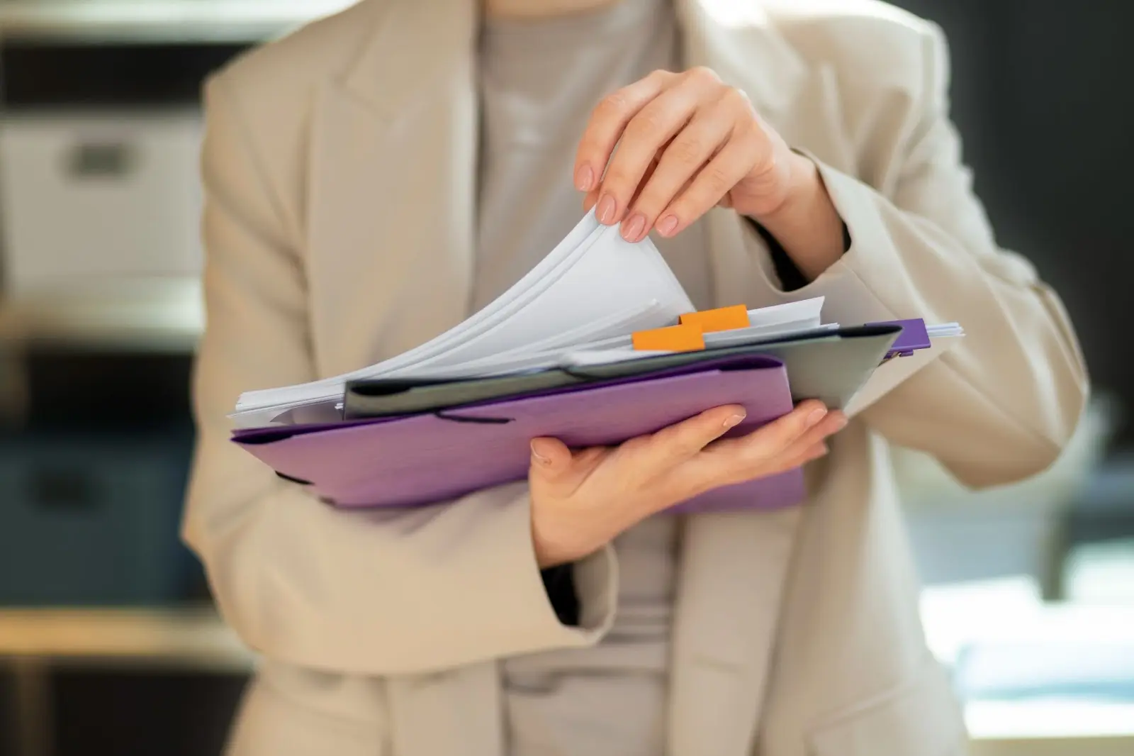 a women holding on to a document