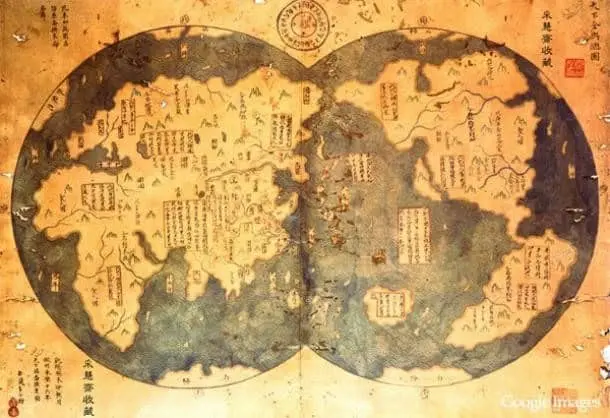 An ancient world map depicting the known continents and regions, featuring detailed illustrations and inscriptions in traditional script.