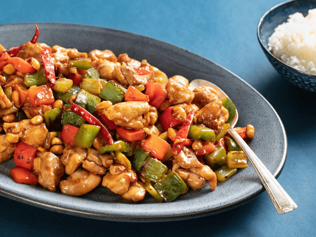 Kung Pao Chicken stir-fried with peanuts, peppers and dried chilies — popular Chinese food