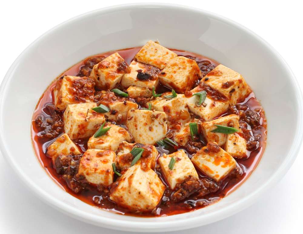 Mapo Tofu in a bowl with spicy Sichuan sauce — traditional Chinese food 