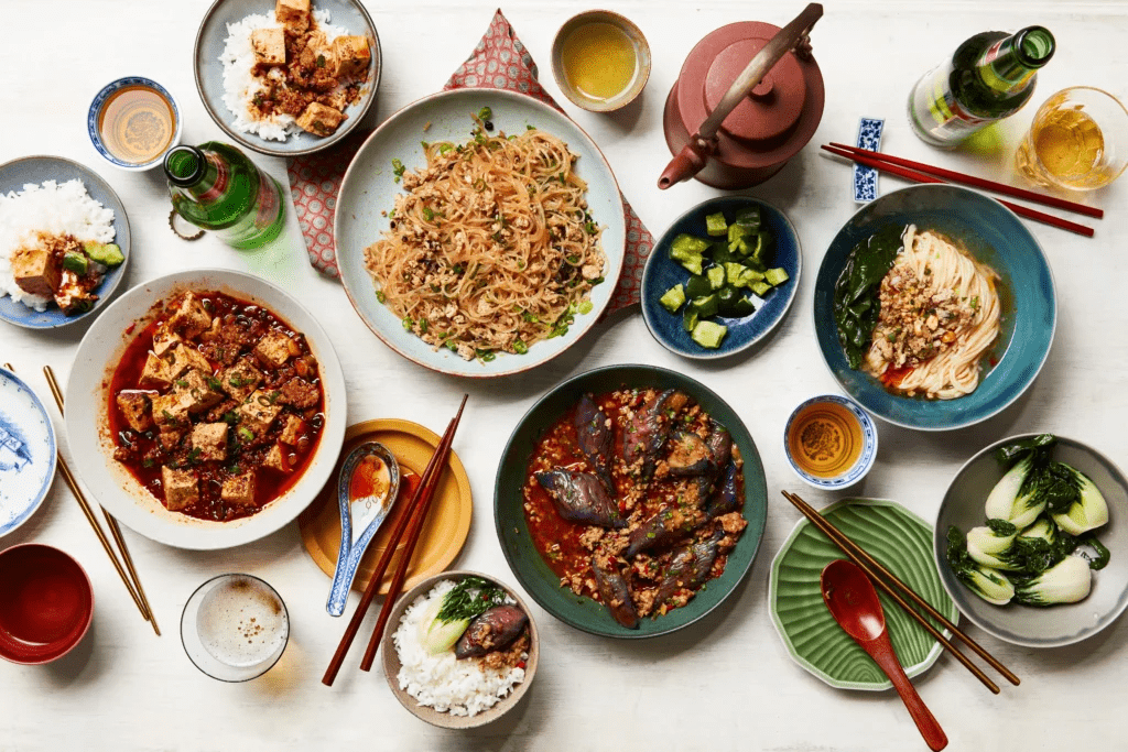 Spread of popular Chinese food dishes including Mapo Tofu, noodles and stir-fried vegetables