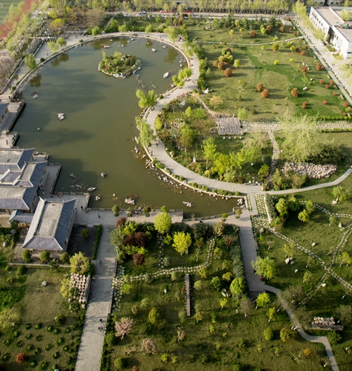 Aerial view of landscaped gardens and lake on the XAFA campus